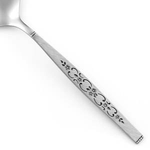 May include: A stainless steel spoon featuring a brushed metal finish on the handle. The handle is decorated with a repeating embossed pattern of small flowers and scrolling vines, ending in a flat base with a series of tiny horizontal indentations.
