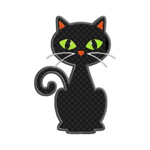 May include: A black cat design with green eyes, orange nose, and orange ear accents. The cat has a polka dot pattern and white whiskers. The cat is sitting upright with its tail curled. The design is likely for Halloween or a cat-themed product.