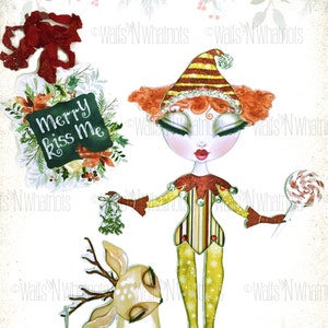 May include: A whimsical paper doll set titled "Kandie Kiss Paper Doll Set." The set includes a doll with red hair and a striped hat, a deer with antlers, and a "Merry Kiss Me" sign. The doll is holding a lollipop and mistletoe.