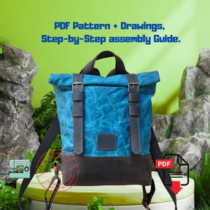 May include: Blue canvas backpack with leather details and straps. The bag has a roll-top closure with buckles and a dark brown leather base. Text on the image reads "PDF Pattern + Drawings, Step-by-Step assembly Guide."
