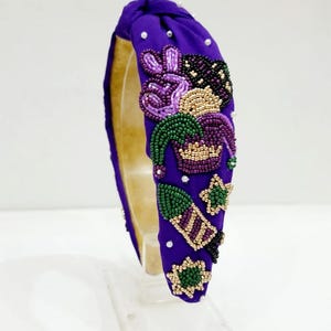 Purple Beaded Headband With Victory Pose And Elegant Design