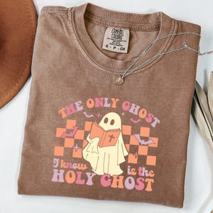Comfort Colors®The Only Ghost, I Know Is The Holy Ghost Shirt, Religious Halloween Shirt, Ghost Reading The Bible, Funny Christian Halloween