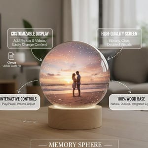 May include: A Memory Sphere with a wood base. The sphere displays a beach scene with a couple. Features include a customizable display, high-quality screen, interactive controls, and a 100% wood base.