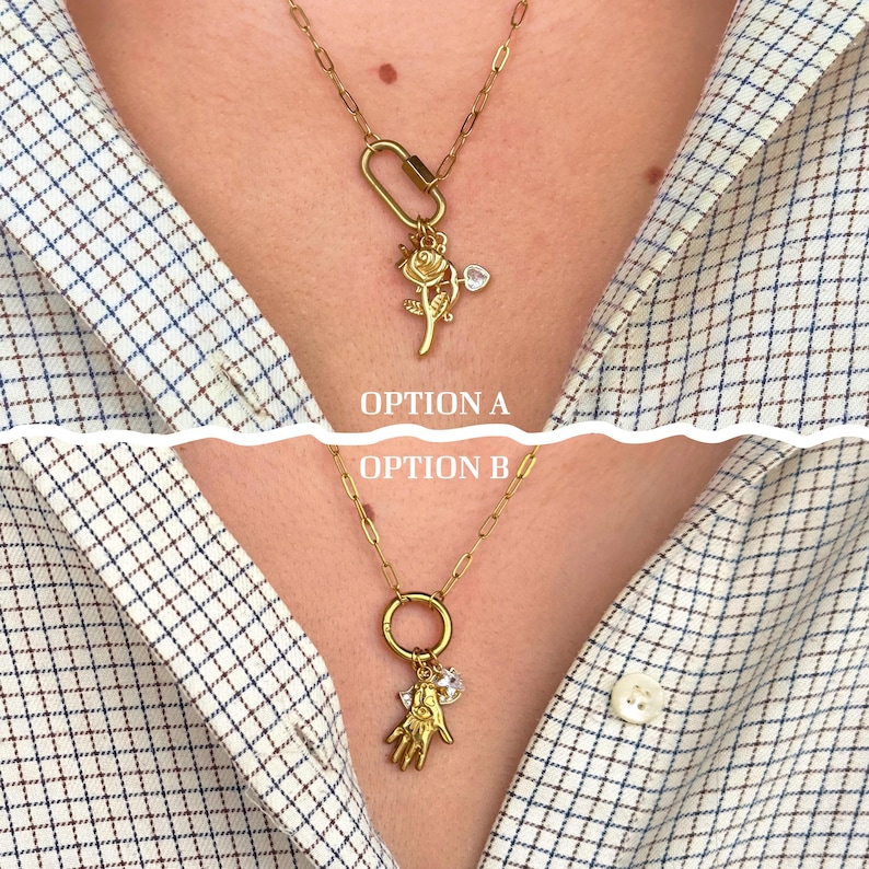 May include: Gold-toned necklaces with different pendant options. Option A features a rose pendant with a heart-shaped gem. Option B showcases a hand pendant and a clear gem. The text "OPTION A" and "OPTION B" are visible.