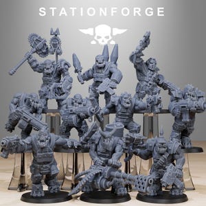 May include: A collection of gray miniature figures of Orcs, each with unique armor and weaponry. The figures are posed in various action stances, with weapons including guns, blades, and a large saw. The text "STATIONFORGE" is at the top.