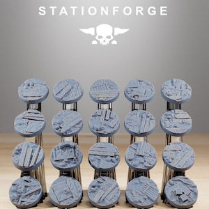 May include: A collection of twenty gray, circular miniature bases with textured surfaces, featuring wooden planks and stone details. The bases are arranged on a chrome display stand. The text "STATIONFORGE" and a skull logo are at the top.