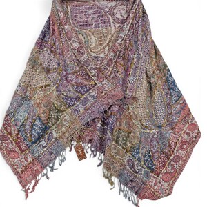 May include: A multi-colored paisley shawl with a patchwork design. The shawl features shades of purple, pink, blue, and green. The edges are finished with a fringe. The shawl is made of a soft, lightweight material.