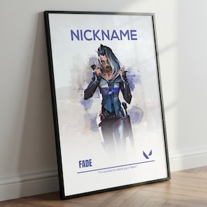 May include: Framed poster featuring a stylized illustration of a character with gray hair and a blue and black outfit. The poster includes the text "NICKNAME" at the top and "FADE" at the bottom, with the quote "I'm excited to taste your fears."