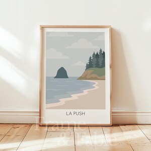 May include: A framed art print featuring a minimalist coastal landscape. The artwork depicts a beach with ocean waves, a rocky island, and a forested cliff under a cloudy sky. The text "LA PUSH" is at the bottom of the print.