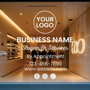 May include: A shop window displaying white text and a logo. The text reads "BUSINESS NAME", "Slogan Or Services", "By Appointment", a phone number, and a website address. Social media icons are at the bottom.