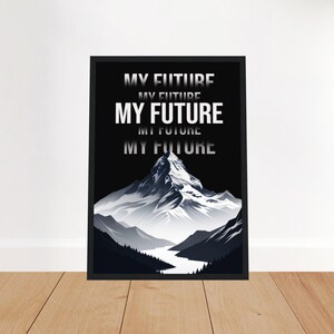 May include: Black framed art print featuring a mountain landscape with a river. The words "MY FUTURE" are stacked vertically in white, with a gradient effect. The artwork is displayed on a wooden floor.