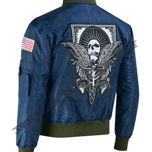 May include: Navy blue bomber jacket with a green collar, cuffs, and hem. Features a large patch on the back with a skull and moth design, and the text "USA 1995". Includes a small American flag patch on the left sleeve.