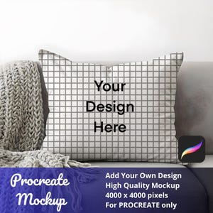 May include: A square pillow with a grid pattern and the text "Your Design Here." The pillow is on a gray couch with a knitted blanket. Below the pillow is the text "Procreate Mockup" and other text.