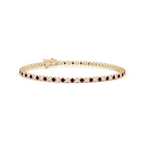 May include: A gold tennis bracelet with alternating red and white gemstones. The bracelet has a secure clasp. The gemstones are evenly spaced along the length of the bracelet. The background is white.