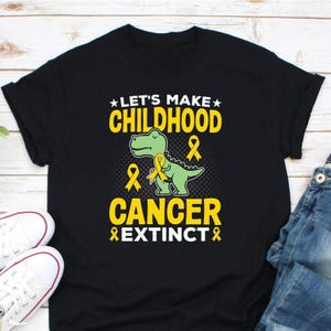 Let&#39;s Make Childhood Cancer Extinct Shirt, Childhood Cancer Shirt, Childhood Cancer Awareness Shirt, Kids Cancer Shirt, Gold Ribbon Shirt