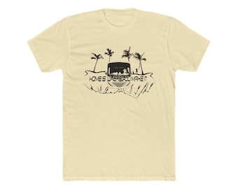 May include: Cream-colored t-shirt featuring a black graphic of a camper, palm trees, and the text "HOME IS WHERE YOU MAKE IT." The design evokes a sense of travel and adventure, perfect for those who love the open road.