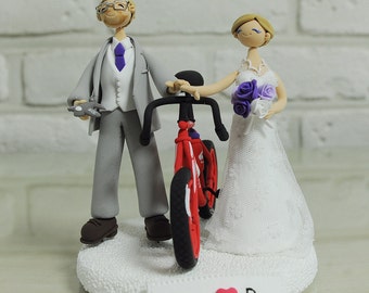 Cycling mania couple with red bike, model airplane wedding cake topper decoration