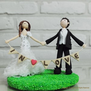 Cute couple holding banner wedding cake topper gift - In Love
