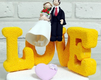 Couple on LOVE statue custom wedding decoration cake topper gift keepsake