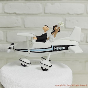 Cute couple on the plane wedding cake topper