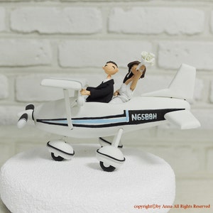 Cute couple on the plane wedding cake topper