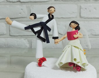 Teacher bride and Jujit-su mania groom wedding cake topper