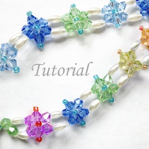May include: A beaded bracelet with a double row of colorful star-shaped beads and white pearl beads. The bracelet has a silver clasp. The word "Tutorial" is written in gray text on a white background.