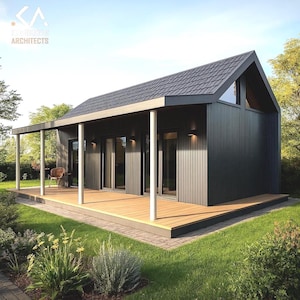 May include: A modern, dark gray cabin with a gabled roof and a wooden deck. The cabin features large glass doors and windows, a covered porch supported by white columns, and is surrounded by green grass and landscaping. The architectural design includes the text "S.A. ARCHITECTS".
