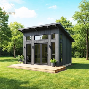 May include: A modern, dark gray shed with a wooden deck, set against a backdrop of green grass and trees. The shed features large glass doors and windows, with a sloped roof. The scene is bathed in natural light, creating a serene outdoor space.