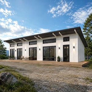 Può includere: Casa bianca moderna con tetto grigio scuro e finestre e porte con cornice nera. La casa ha un ponte di legno ed è circondata da alberi e un vialetto di ghiaia. Il cielo è blu con nuvole sparse.