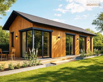 Può includere: Una moderna casa in legno a un piano con tetto nero e ampie vetrate. La casa ha un ponte di legno ed è circondata da un prato verde e alberi. Il testo "KONIKKOS ARCHITECTS" è visibile nell'angolo in alto a destra.