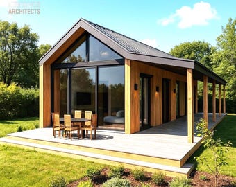 Può includere: Casetta moderna con esterno in legno, tetto scuro e ampie vetrate. Un ponte con tavolo e sedie si estende dalla casetta. La casetta è circondata da erba verde e alberi. Il logo "KA Architects" è visibile.