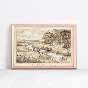 May include: A framed sepia-toned print of a landscape featuring a small wooden bridge over a stream. The artwork depicts a winding path through a forest and fields. The text "The Hundred Acre Wood - River Crossings" is at the bottom.