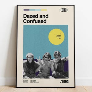 May include: A framed poster featuring the movie title "Dazed and Confused" with a retro design. The poster includes a photo of three people, a yellow circle, and the year 1993. The poster has a black frame.