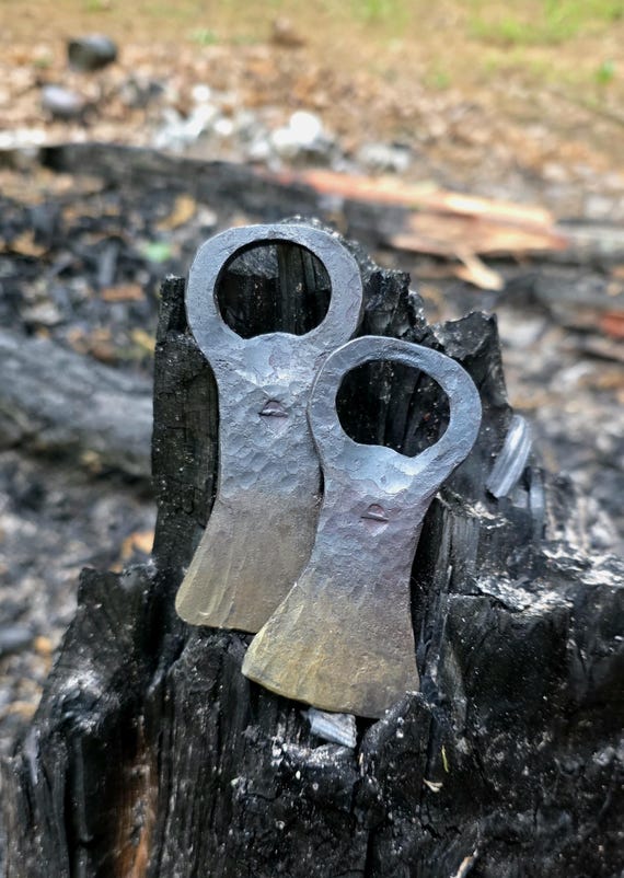 A blacksmith actually hammer-forged this bottle opener from steel — it's a functional tool with visible craft marks that makes every other bottle opener look embarrassingly boring.