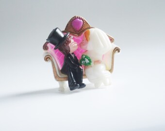 Vintage Wedding Cake Topper: Kissing Couple on Pink Loveseat (3 Inch)