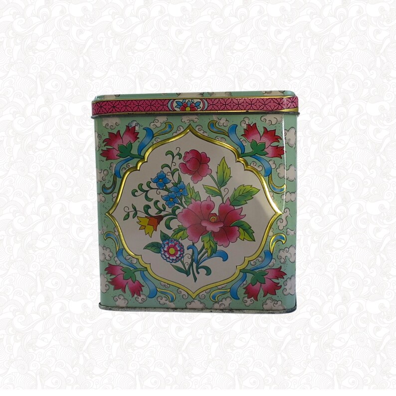 Daher vintage floral pattern storage tin, approximately 4 inches high with hinged lid. Perfect Gift for vintage collectors or farmhouse kitchen decor.  More vintage gifts and supplies at swirlingorange11