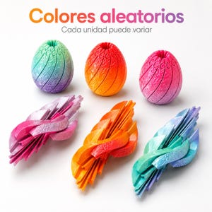 May include: Three egg-shaped objects with textured surfaces and three matching collapsed, fan-like structures in gradient colors of blue-green, orange-yellow, and pink-purple. Text at the top reads Colores aleatorios Cada unidad puede variar.