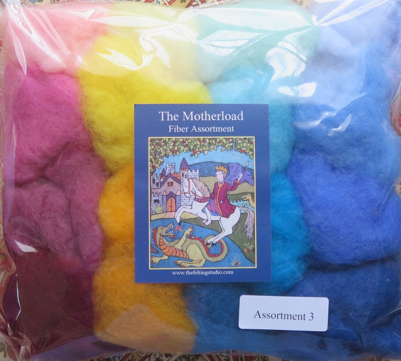 May include: A plastic bag filled with colorful wool roving, labeled "The Motherload Fiber Assortment" and "Assortment 3". The label features a medieval-style illustration of a knight on a horse fighting a dragon.
