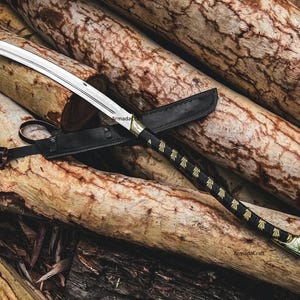 May include: A handcrafted sword with a curved blade and a black handle adorned with gold-colored accents. The sword rests on a bed of wooden logs, accompanied by a black leather sheath.