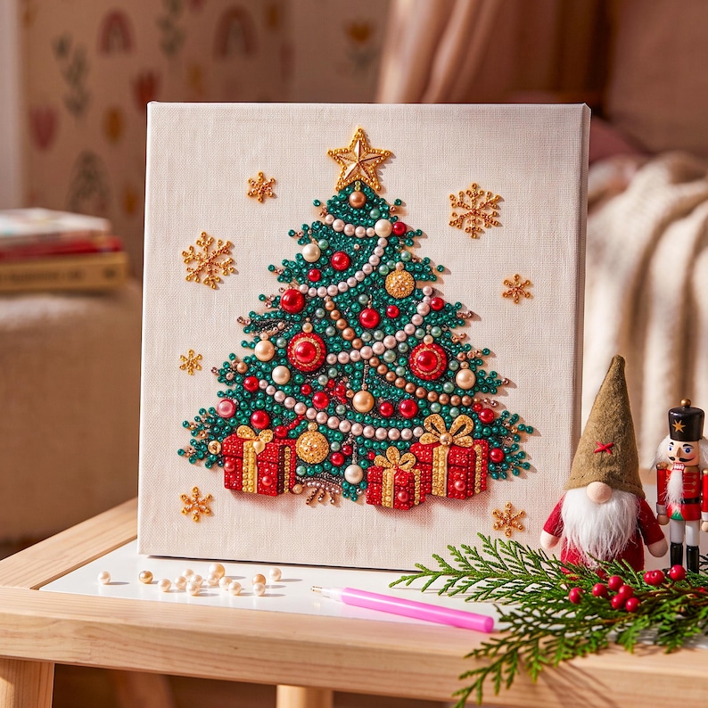 May include: A square canvas featuring a diamond art Christmas tree design with green, red, and gold beads. The tree is topped with a gold star and decorated with pearls and red ornaments. Three red gift boxes with gold ribbons sit at the base.