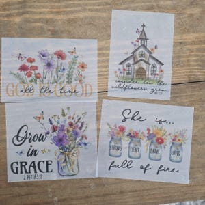 May include: Four rectangular prints with floral designs and inspirational quotes. One print reads "God all the time," another features a church and the quote "consider how the wildflowers grow." The third says "Grow in Grace," and the last says "She is... full of fire."