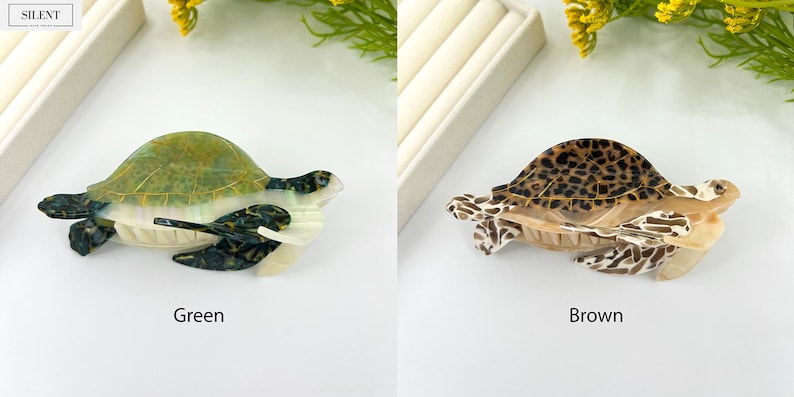 May include: Two decorative turtle figurines. One is green and white, the other is brown with a spotted pattern. The figurines are on a white surface. The word "SILENT" is in the upper left corner.