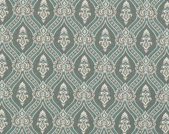May include: A detailed fabric pattern featuring a repeating design of teal, gray, and white ornate shapes. The pattern has a damask style with a textured appearance, suitable for upholstery or decorative projects.