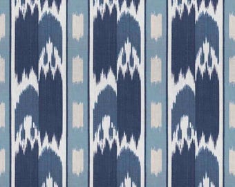May include: A fabric with a repeating vertical pattern in shades of blue, white, and beige. The design features stylized, abstract shapes resembling arches and vertical stripes, creating a textured appearance. The color palette includes navy, light blue, and off-white.