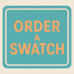 May include: A square sign with rounded corners features the text "ORDER A SWATCH" in orange letters on a teal background. The sign has a white border and is set against a cream-colored backdrop.