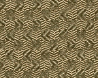 May include: A close-up of a textured fabric with a repeating pattern. The pattern consists of alternating rows of dark olive green and beige chevron shapes. The fabric has a woven appearance, with visible texture and subtle variations in color.