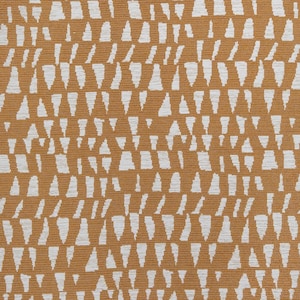 May include: A woven fabric featuring a repeating pattern of white, vertically oriented, abstract triangular shapes set against a solid mustard yellow background. The texture of the textile is visible, showing a consistent horizontal weave throughout.