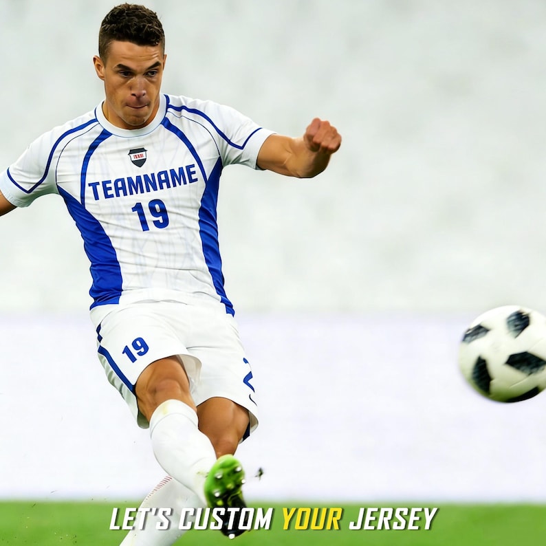 May include: A white and blue soccer jersey featuring the text TEAMNAME and the number 19 on the chest, paired with matching white shorts with the number 19. The text LET'S CUSTOM YOUR JERSEY is displayed at the bottom of the image.