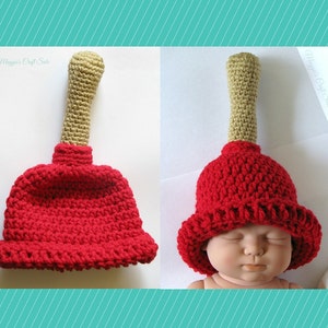 Puede incluir: Un gorro de ganchillo rojo y beige con forma de &eacute;mbolo. El gorro lo lleva un beb&eacute;.
